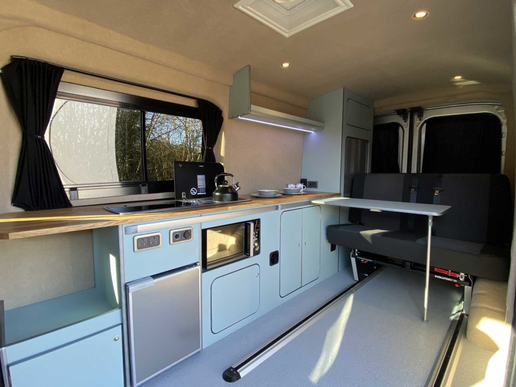 Campervan Conversions UK like this duck egg blue camper interior