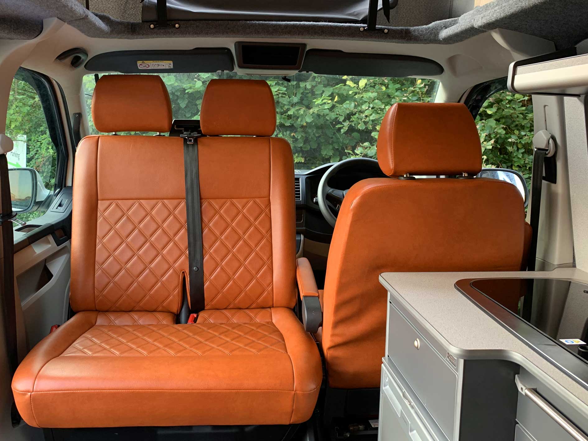 Orange seats upholstery in campervan