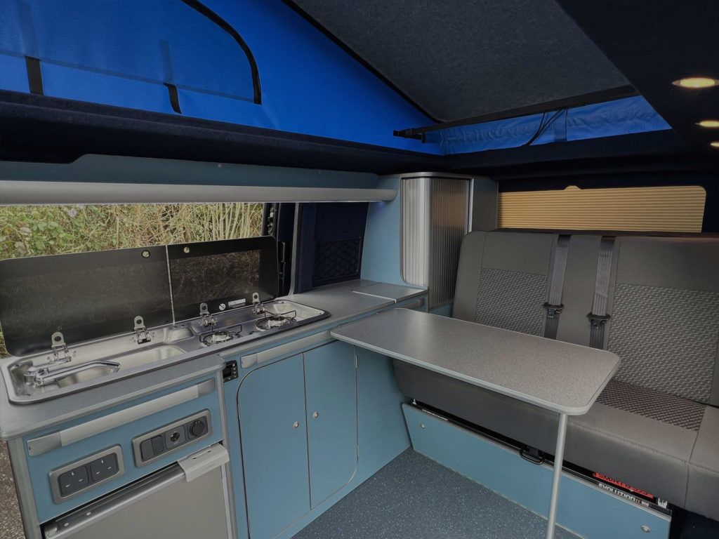hudson campervan interior design with retro light blue finish and grey upholstery
