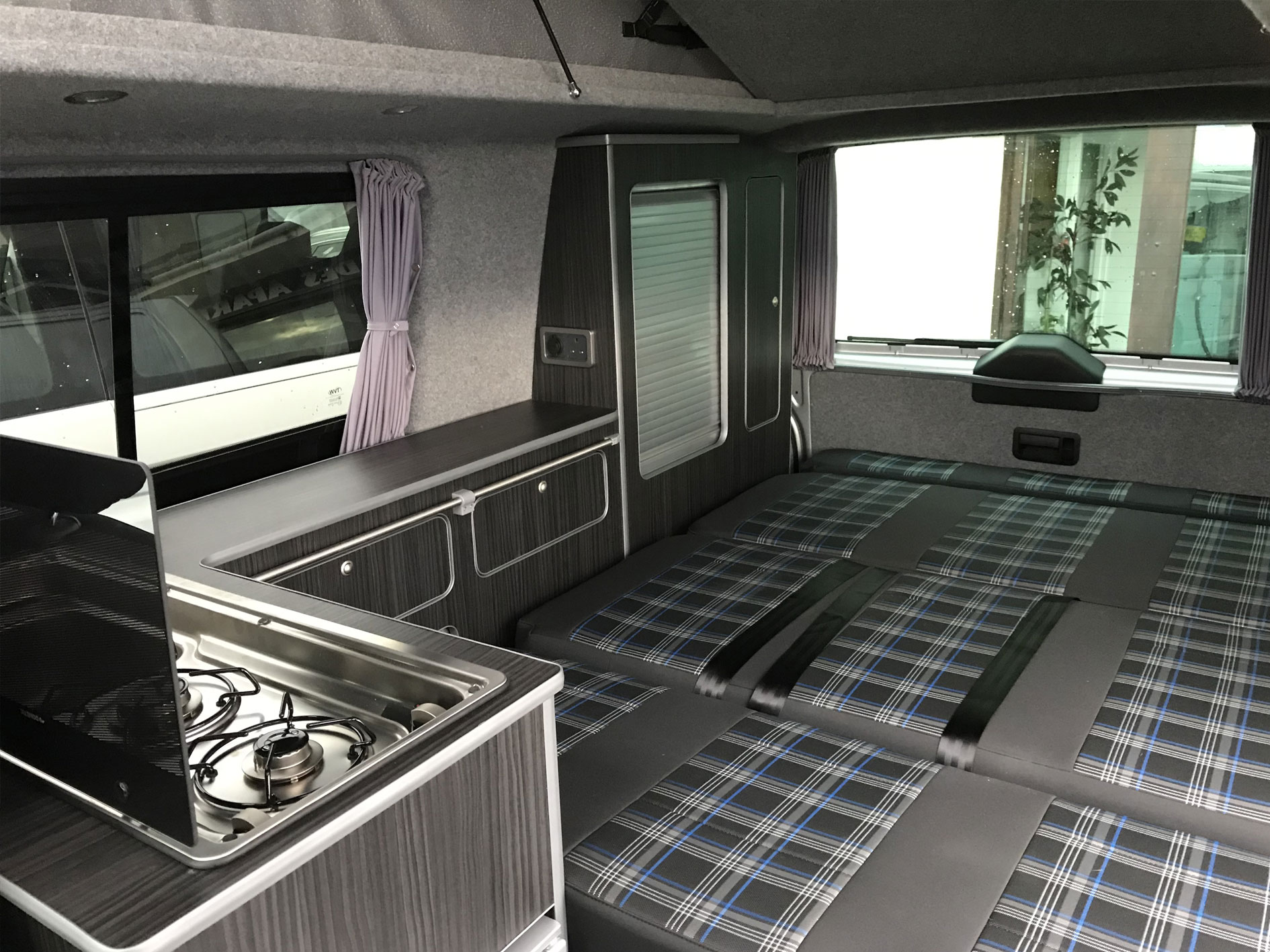 drake camper conversion with seat laid into bed